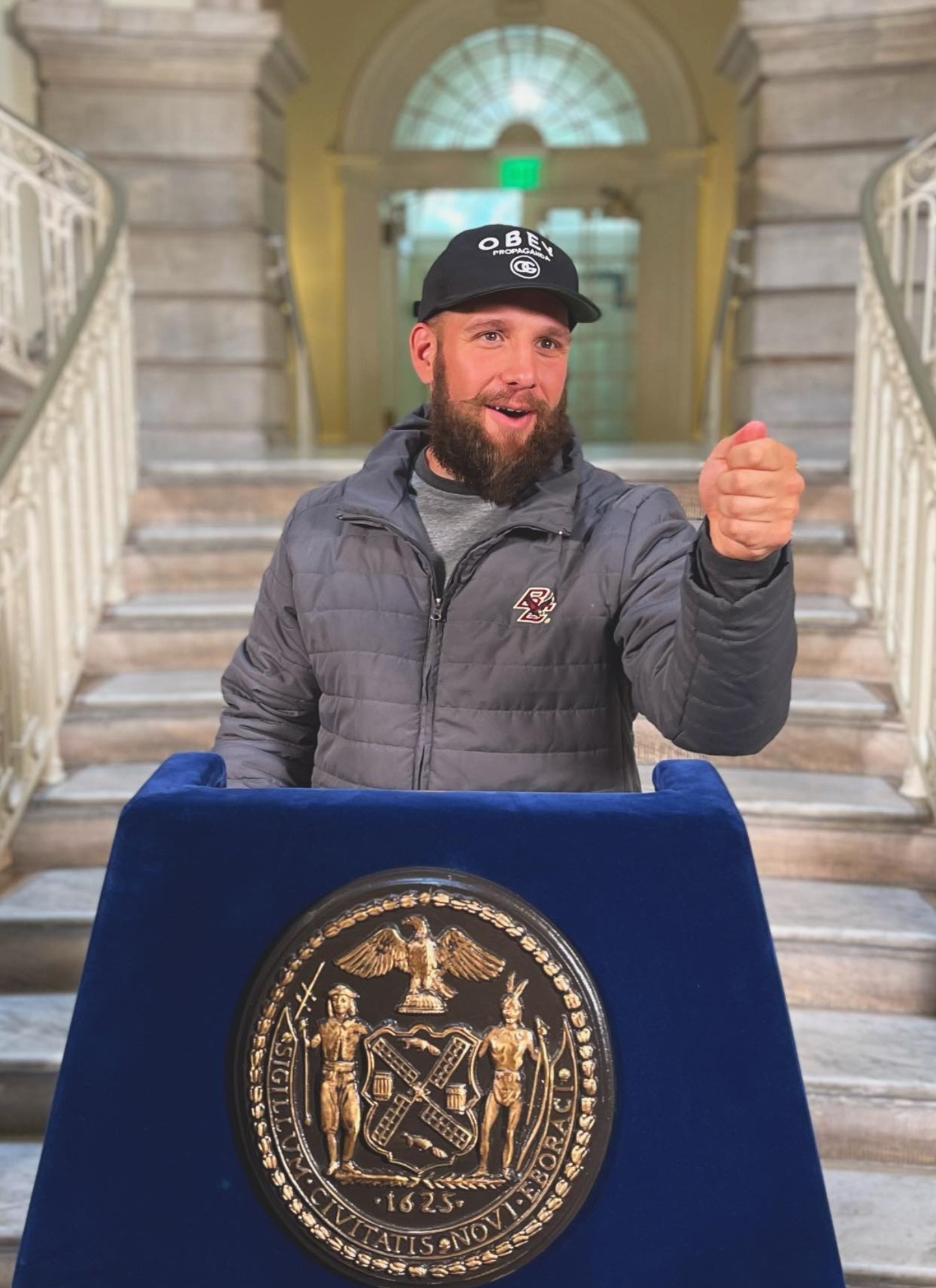 Brett Fink speaking at a podium at NYC Town Hall during a celebration of The Notorious B.I.G.